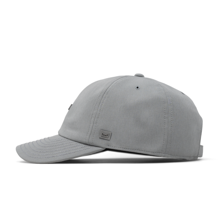 The side view of the melin The Legend Hydro Performance Dad Hat in heather grey