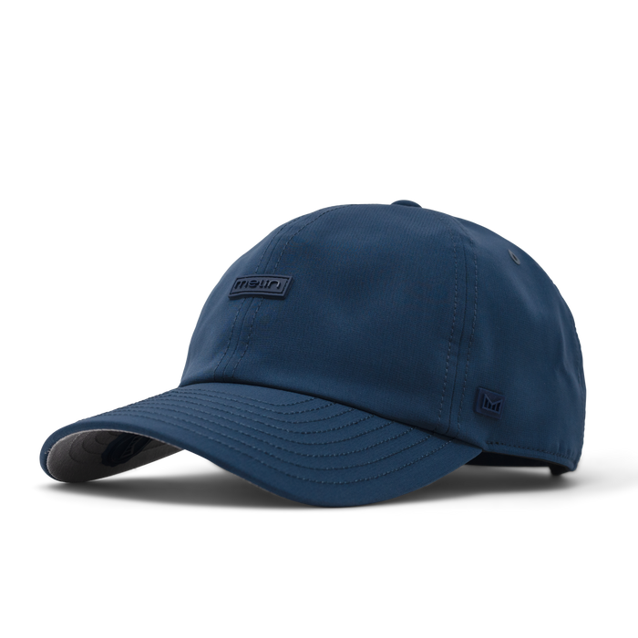 The angled view of the melin The Legend Hydro Performance Dad Hat in navy