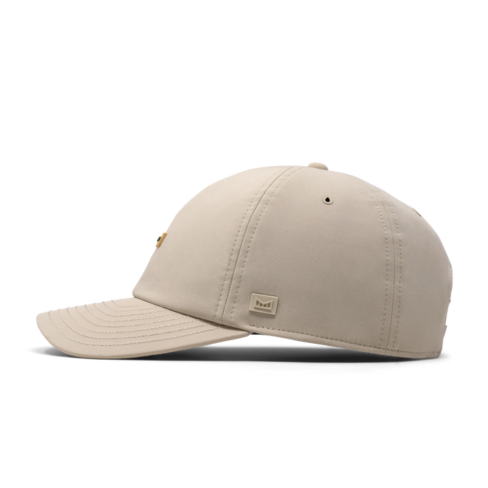 The side view of the melin The Legend Hydro Performance Dad Hat in Sandshell