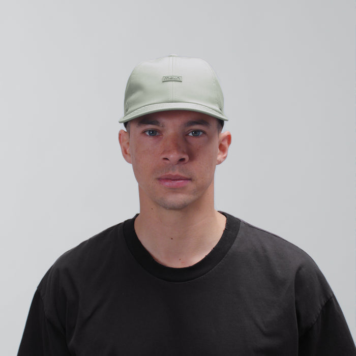 The model-image view of the melin Performance Dad Hat The Legend Hydro  in Shadow Sage