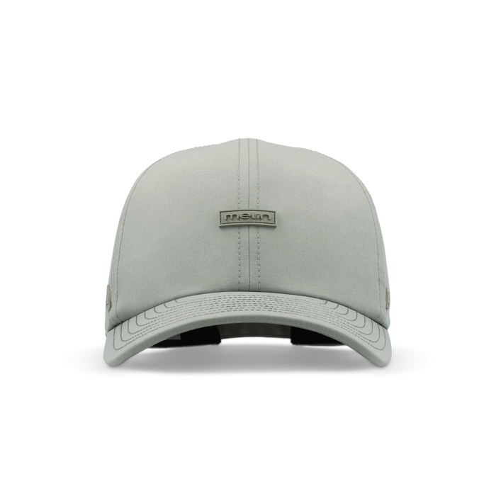 Light gray baseball cap with metal brand logo on crown and textured visor detail.