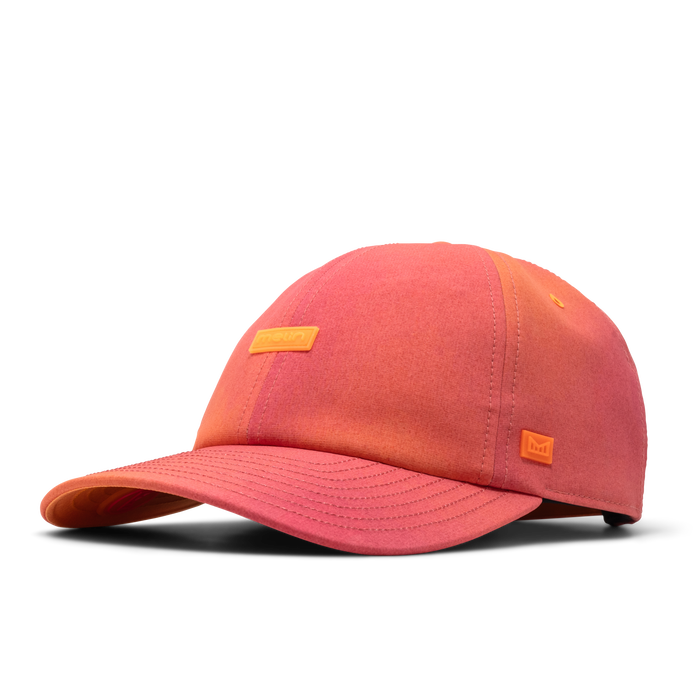 The front, angled view of the melin The Legend Hydro  Performance Dad Hat in Sunset Aura
