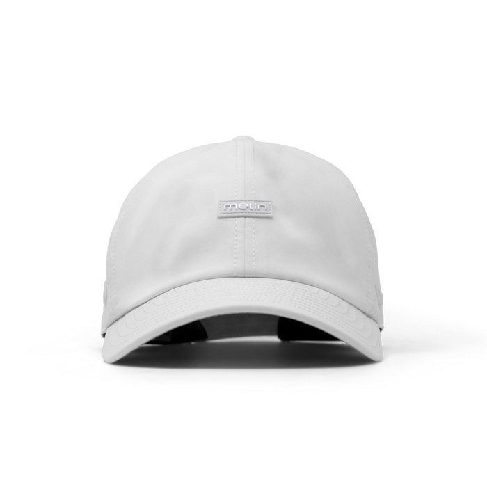 The frontal view of the melin The Legend Hydro Performance Dad Hat in white