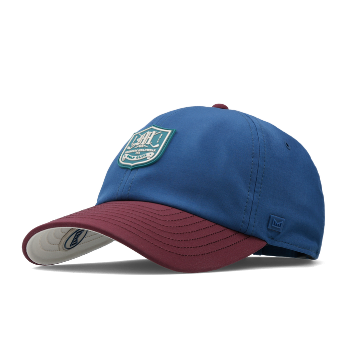 The front, angled view of the melin Performance Dad Hat The Legend Links Clubhouse Hydro in grandeur