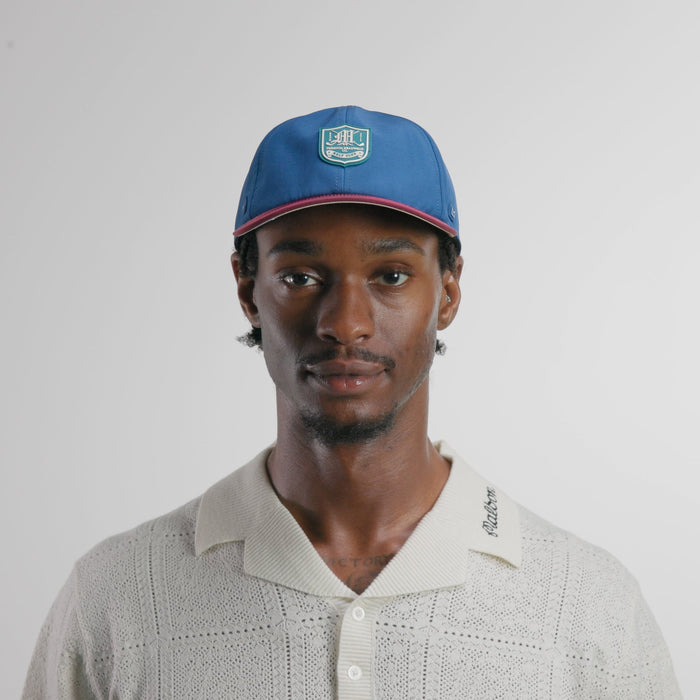 The model-image view of the melin Performance Dad Hat The Legend Links Clubhouse Hydro in grandeur