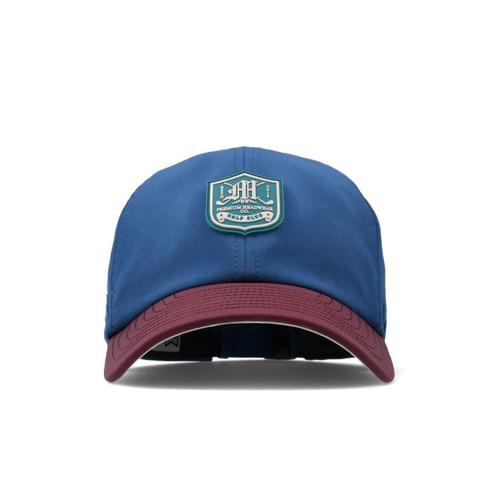 The front view of the melin Performance Dad Hat The Legend Links Clubhouse Hydro in grandeur