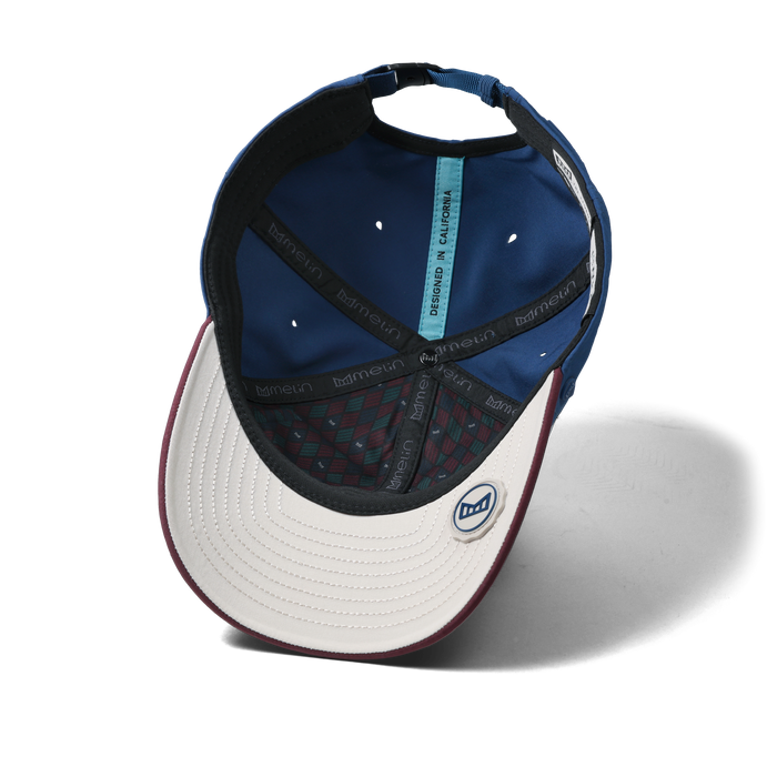 The inside view of the melin Performance Dad Hat The Legend Links Clubhouse Hydro in grandeur