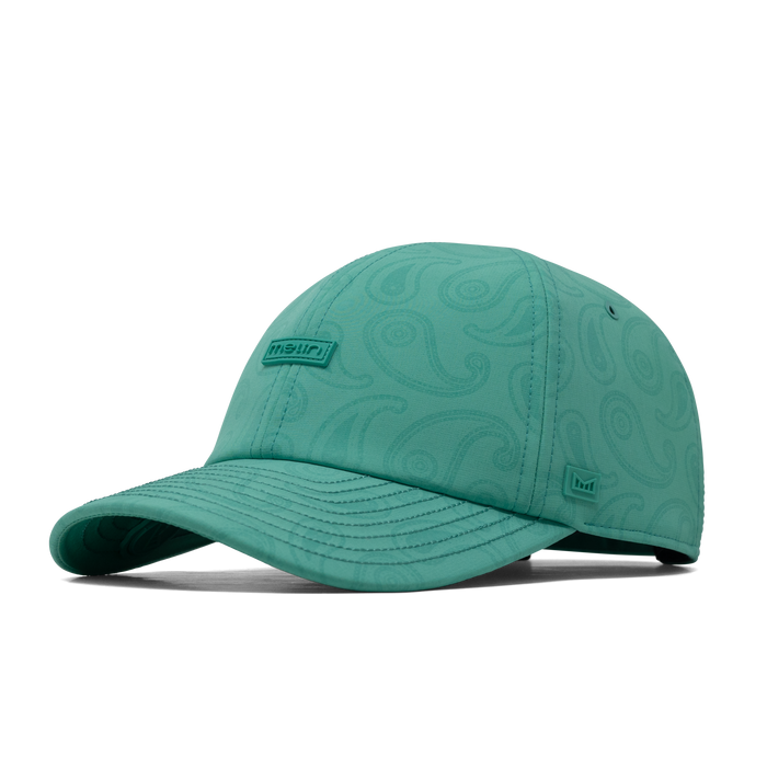 The front, angled view of the melin Performance Dad Hat The Legend Links Hydro  in  Neon Aqua