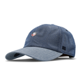 The angled view of the melin The Legend Mill United Performance Dad Hat in chambray