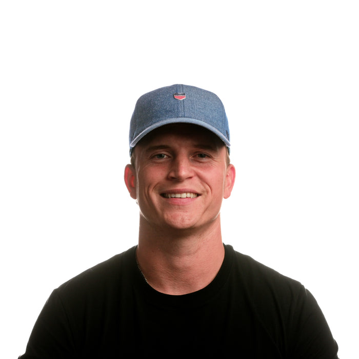 The model-image view of the melin Performance Dad Hat The Legend Mill United in Chambray