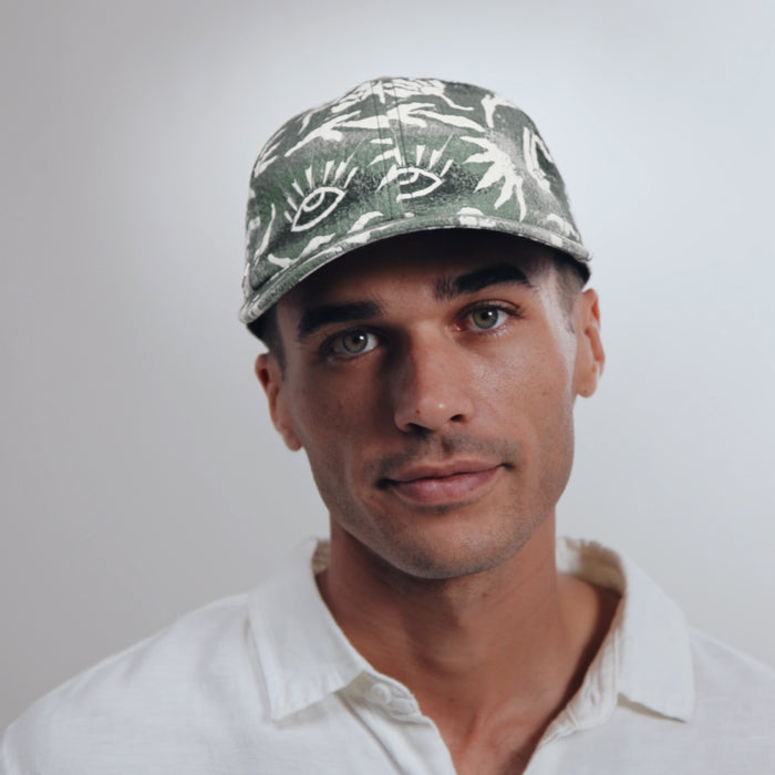 The model-image view of the melin The Legend Mill Visions Performance Dad Hat in Garden