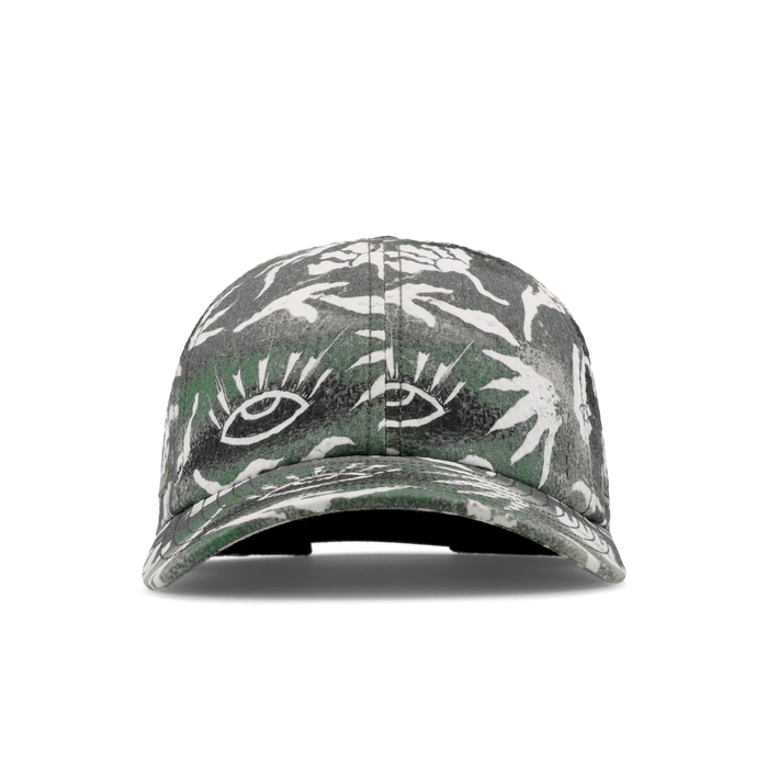 The frontal view of the melin The Legend Mill Visions Performance Dad Hat in garden