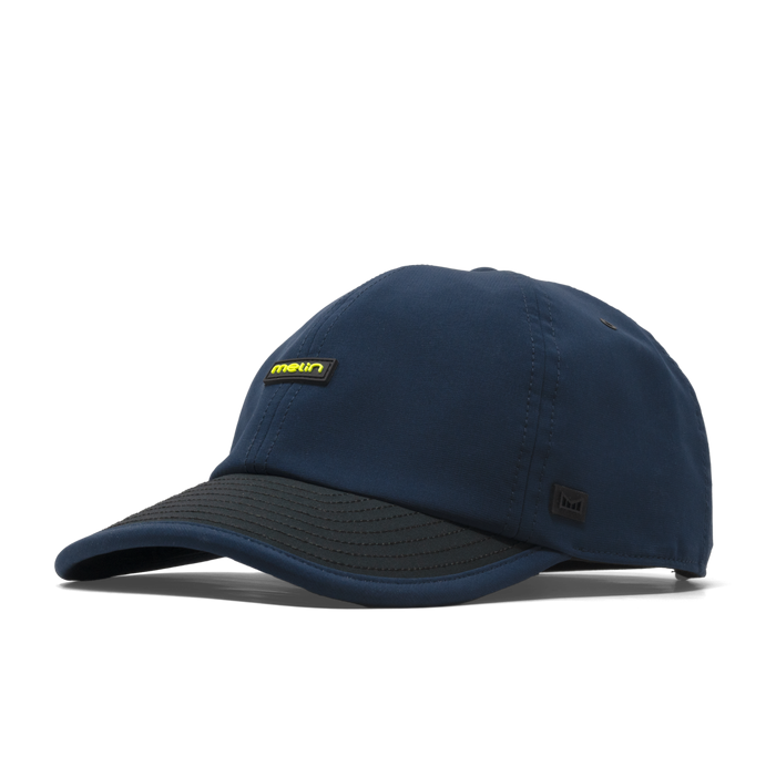 The front, angled view of the melin Performance Dad Hat The Legend MPH Hydro in  Black Iris / Black