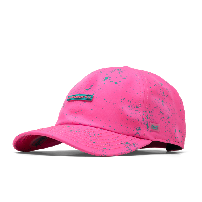 The angled view of the melin The Legend Neon Hydro Performance Dad Hat in hot pink