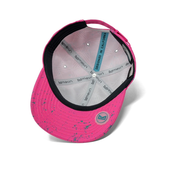 The inside view of the melin The Legend Neon Hydro Performance Dad Hat in hot pink