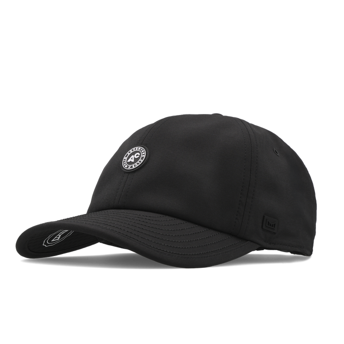 The angled view of the melin The Legend Packable Hydro Performance Dad Hat in black