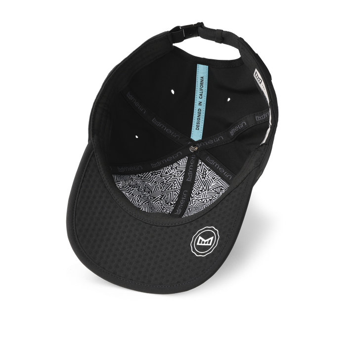 The inside view of the melin The Legend Packable Hydro Performance Dad Hat in black