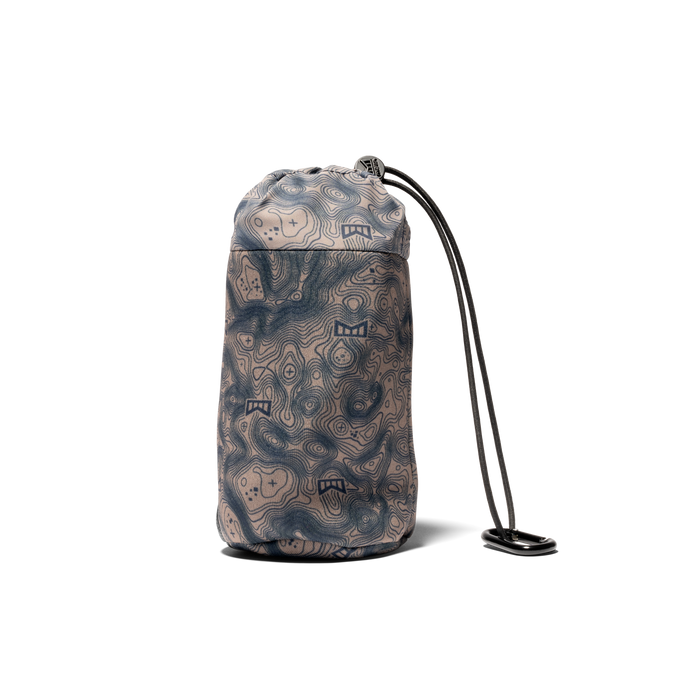 Packable rain jacket in rain camo pattern, shown compressed in its stuff sack with drawstring cord.