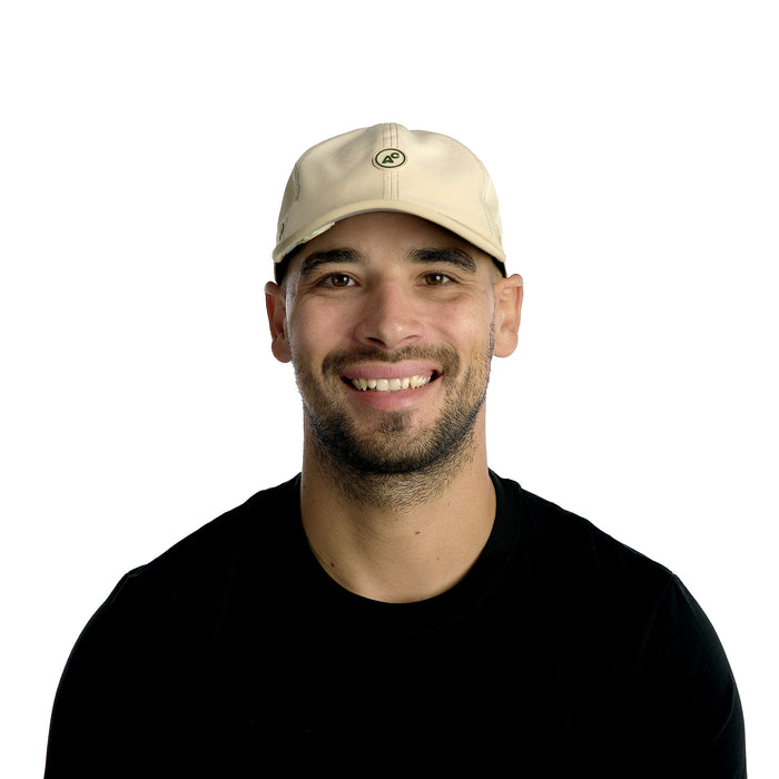 The model-image of the Melin Vintage Fit Legend Packable Hydro hat in Sand
