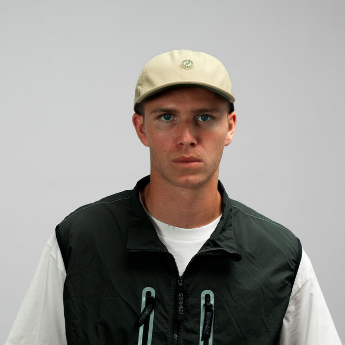 The model-image of the Melin Vintage Fit Legend Packable Hydro hat in Sand