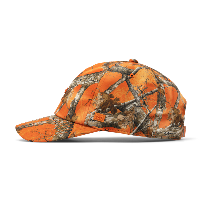 The side view of the melin The Legend Realtree Hydro Performance Dad Hat in neo camo