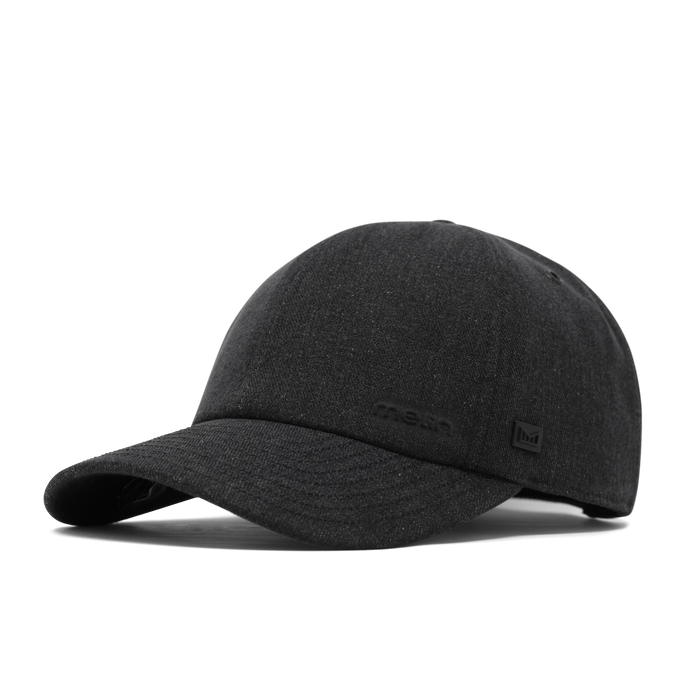 The front, angled view of the melin The Legend Thermal  Performance Dad Hat in Black Denim