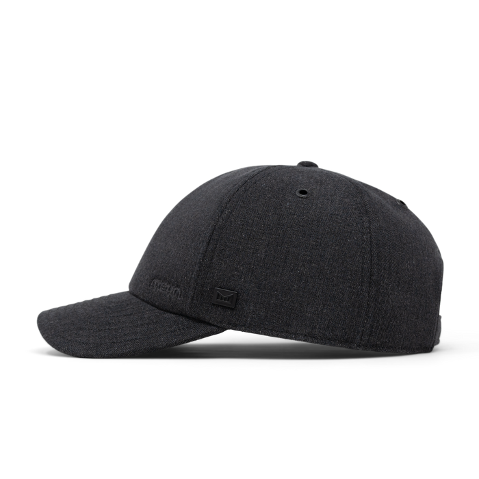 The side view of the melin The Legend Thermal  Performance Dad Hat in Black Denim