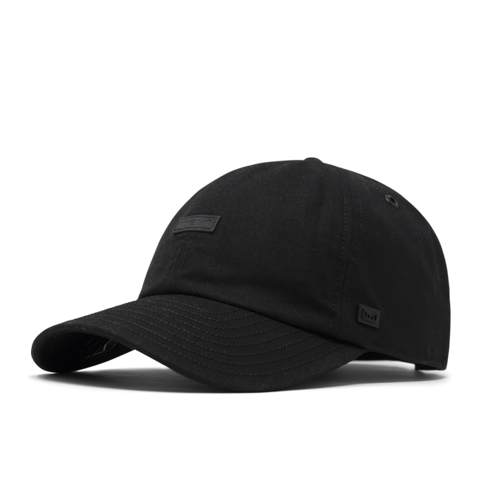 The front, angled view of the melin The Legend Thermal  Performance Dad Hat in Black