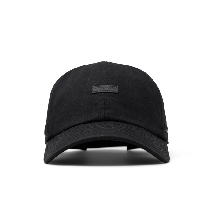 The front view of the melin The Legend Thermal  Performance Dad Hat in Black