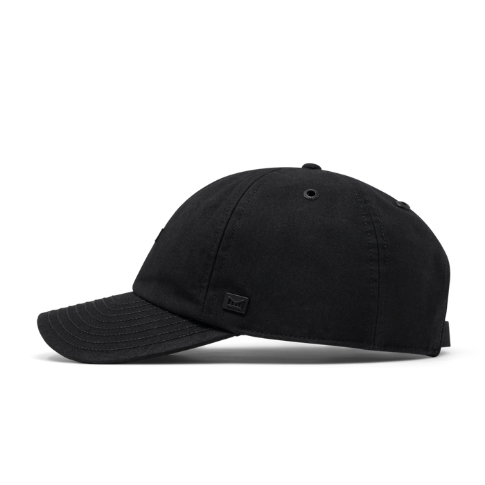 The side view of the melin The Legend Thermal  Performance Dad Hat in Black