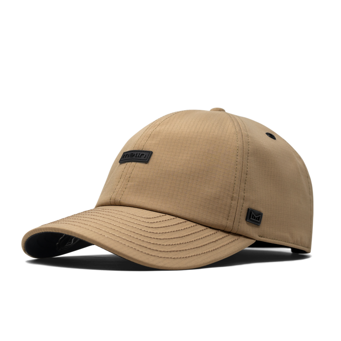 The front, angled view of the melin The Legend Thermal  Performance Dad Hat in Khaki