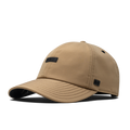 The front, angled view of the melin The Legend Thermal  Performance Dad Hat in Khaki