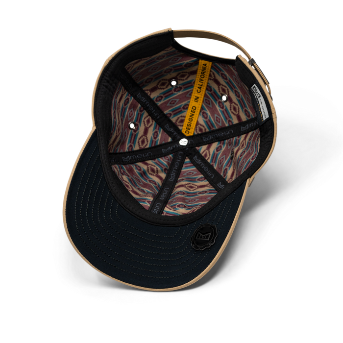 The inside view of the melin The Legend Thermal  Performance Dad Hat in Khaki