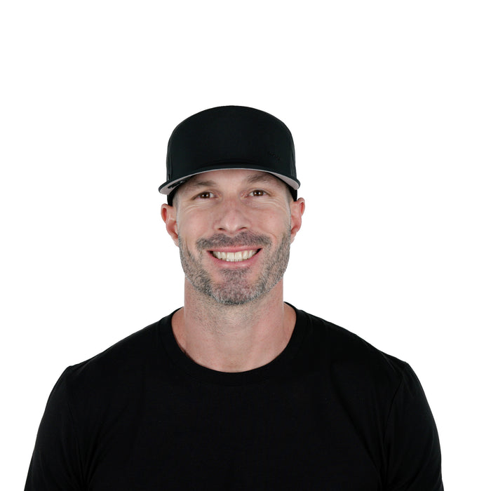 The model-image of melin's Trenches Hydrolite snapback hat in Black