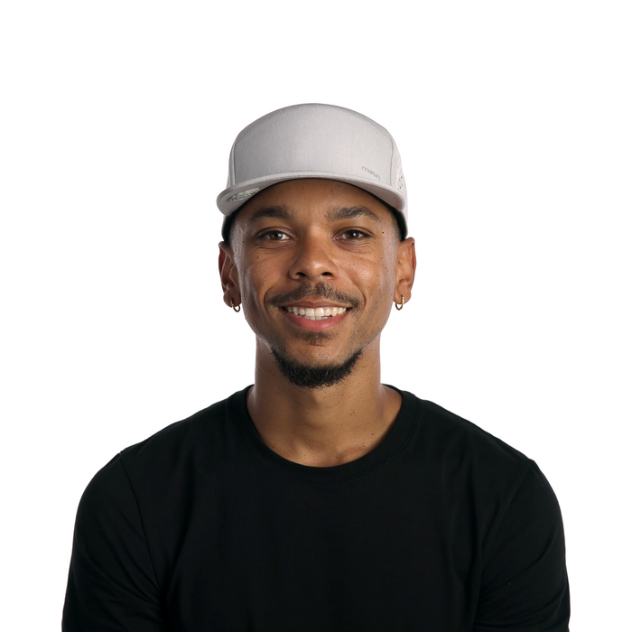 The model-image of melin's Trenches Hydrolite snapback hat in Heather Grey