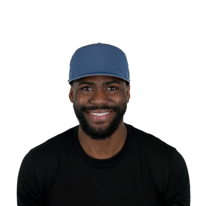 The model-image of melin's Trenches Hydrolite snapback hat in Steel Blue