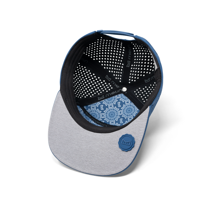 The inside view of melin's Trenches Hydrolite snapback hat in Steel Blue