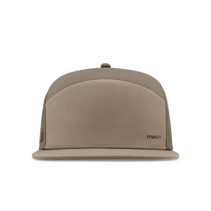 The frontal view of the melin Horizon Fit Trenches Hydrolite hat in teak