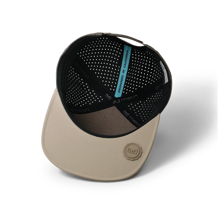 The inside view of the melin Horizon Fit Trenches Hydrolite hat in teak