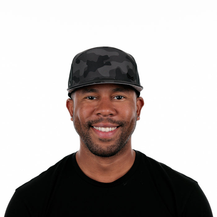The model-image of the Melin Horizon Fit Treches Icon Hydro hat in Black Camo