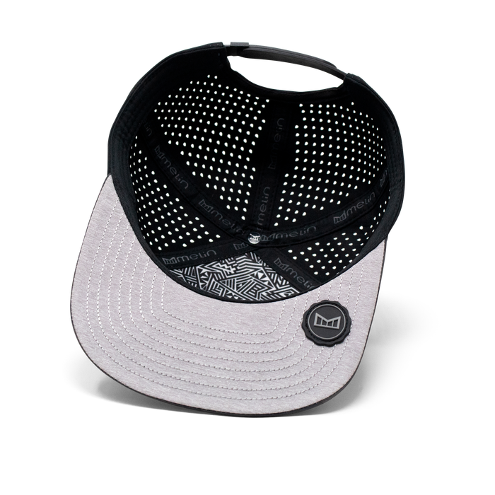 The inside view of the Melin Horizon Fit Treches Icon Hydro hat in black camo