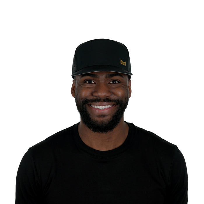The model-image of the Melin Horizon Fit Trenches Icon Hydro hat in Black Gum