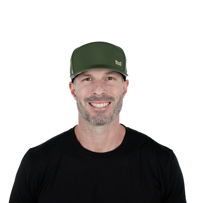 The model-image of the Melin Horizon Fit Trenches Icon Hydro hat in Canopy / Khaki