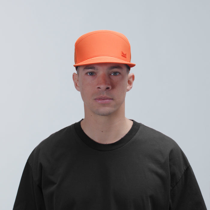 The model-image view of the melin Horizon Fit Trenches Icon Hydro hat in Flame