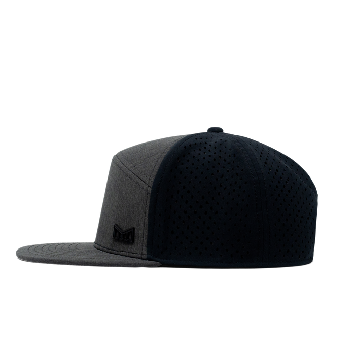 The side view of the Melin Horizon Fit Trenches Icon Hydro hat in black