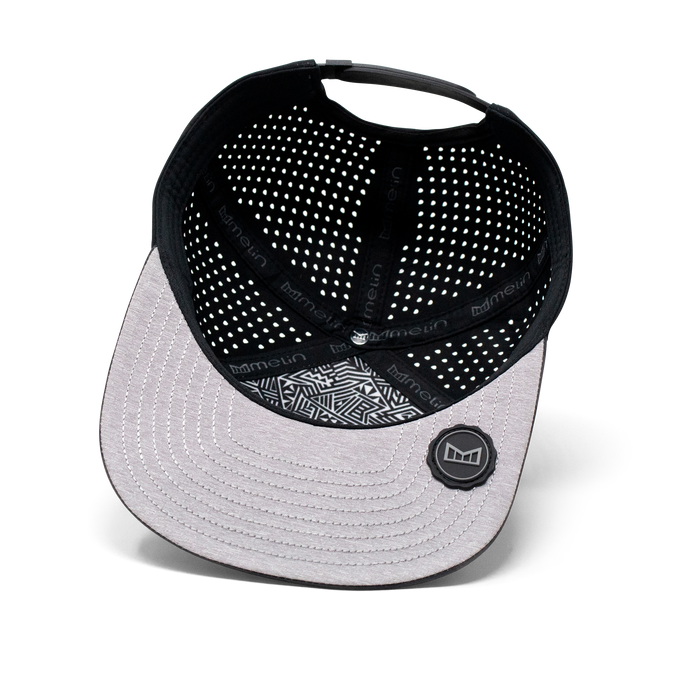 The inside view of the Melin Horizon Fit Trenches Icon Hydro hat in black