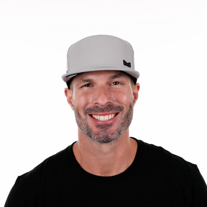 The model-image of the Melin Horizon Fit Trenches Icon Hydro hat in Heather Grey