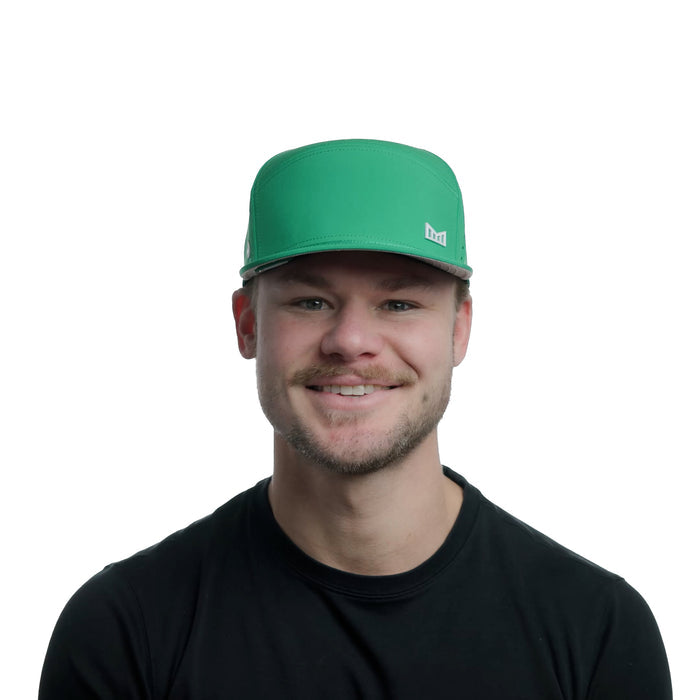 The model-image of the Melin Horizon Fit Trenches Icon Hydro hat in Kelly Green