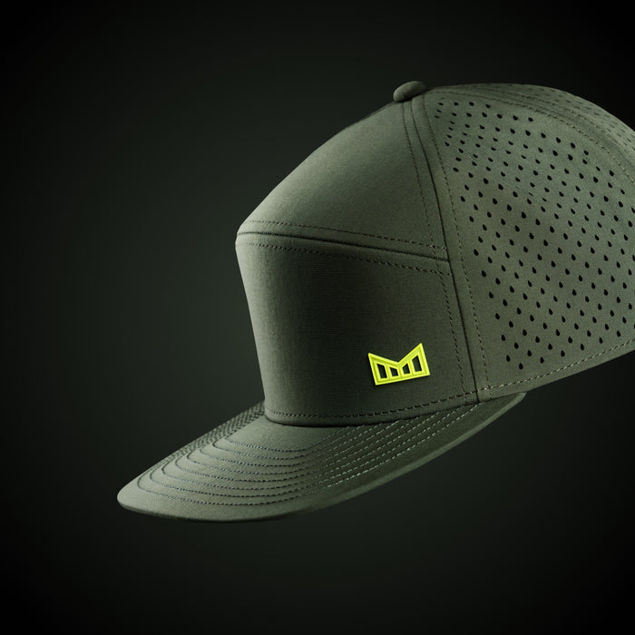 The studio image of the Trenches Icon Hydro in Kombu Green against a green background
