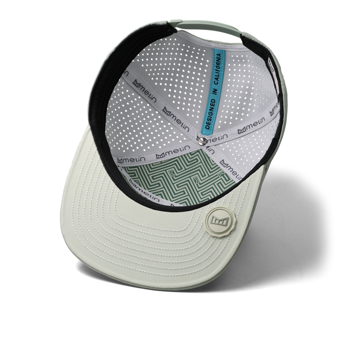 The inside view of the melin Horizon Fit Trenches Icon Hydro hat in misty trails
